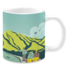 White ceramic 11oz mug featuring an outdoor camping-themed design with hikers carrying backpacks and a red flag, walking through a scenic landscape of rolling green hills and blue mountains, accompanied by the text "Let’s Go Camping" in elegant white lettering.