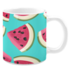 White ceramic 11oz mug featuring a playful pattern of vibrant watermelon slices with pink flesh, black seeds, and green rinds, set against a bright turquoise background, evoking a fresh and summery vibe.