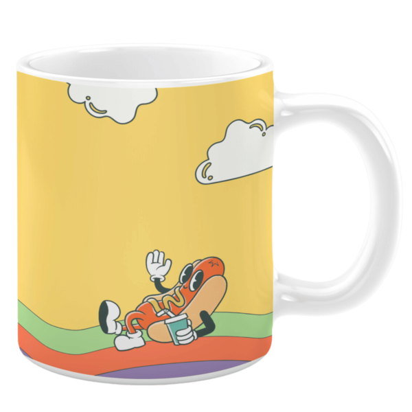 White ceramic 11oz mug featuring a whimsical design of a cheerful hotdog character lounging on colorful wavy stripes, holding a drink, and waving against a bright yellow background with cartoon-style clouds.