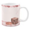 White 11oz ceramic mug featuring a charming bakery-themed design. It includes illustrations of a pie and stacked brownies on a pink gingham tablecloth, with a striped awning at the top and delicate outlines of utensils in the background, creating a cozy and nostalgic feel.