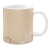 White 11oz ceramic mug featuring a textured beige background with a minimalist design. It includes delicate white line art of flowers and a subtle mountain outline at the base, creating a natural and earthy aesthetic.