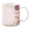 White 11oz ceramic mug featuring a soft pink background with an elegant floral border design. The arrangement includes blush pink and deep mauve flowers accented with green leaves and delicate gold detailing, creating a sophisticated and romantic aesthetic.