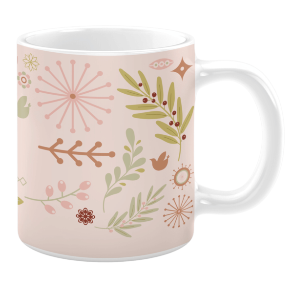 White 11oz ceramic mug featuring a pastel pink background adorned with a variety of botanical and nature-inspired illustrations, including leaves, berries, flowers, and abstract designs, creating a soft and whimsical aesthetic.