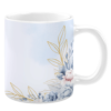 White ceramic 11oz mug featuring an elegant design with delicate watercolor flowers in soft blue and blush tones, accented by golden leaves, set against a light pastel gradient background for a sophisticated and calming look.