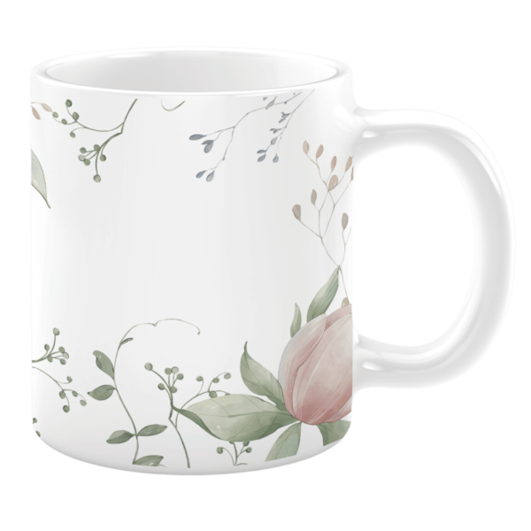 This mug showcases a soft, botanical design with gentle greenery and a delicate pink tulip. Its minimalist style adds a serene touch, perfect for your coffee or tea moments.