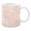White ceramic 11oz mug with a peach and gray marbled design featuring soft, swirling patterns.