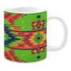 This mug has a colorful pattern with diamonds, stars, and zigzags in bright greens, reds, and yellows.
