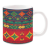 Colorful geometric pattern mug with red, green, and yellow tribal design