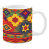 White ceramic 11oz mug featuring a vibrant geometric pattern with starburst and diamond shapes in bold shades of yellow, red, purple, and green.