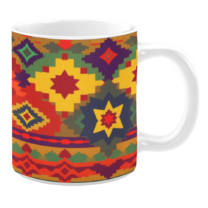 White ceramic 11oz mug featuring a vibrant geometric pattern with starburst and diamond shapes in bold shades of yellow, red, purple, and green.