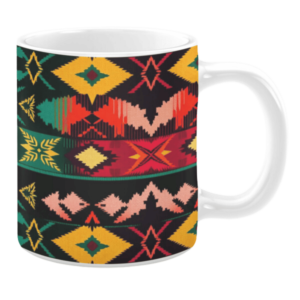White ceramic 11oz mug featuring a vibrant geometric design with bold diamond, arrow, and zigzag patterns in red, yellow, green, and black, arranged in horizontal stripes.