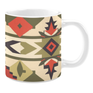 White ceramic 11oz mug featuring a bold geometric pattern with diamond, arrow, and angular shapes in shades of olive green, red, cream, and black, arranged in horizontal bands.