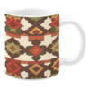 White ceramic mug featuring a warm and earthy geometric pattern with shades of red, orange, brown, and green, set against a light beige background, creating a rustic and Southwestern-inspired design.