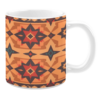White ceramic mug featuring a Southwestern-inspired geometric design with bold red, orange, brown, and teal shapes, creating a striking and vibrant pattern reminiscent of desert and tribal aesthetics.