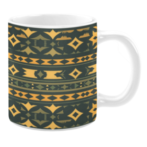White ceramic mug featuring a rich geometric pattern in earthy green and mustard yellow tones, with diamond and arrow-like shapes, creating a warm and Southwestern-inspired design.