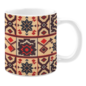 Ceramic mug with intricate geometric motifs in beige, red, navy blue, and maroon tones, featuring star shapes, diamonds, and grid-like patterns.