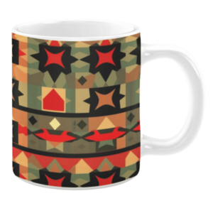 Ceramic mug featuring a geometric pattern with bold star and diamond shapes in red, black, and earthy tones, accented by green and orange hues.