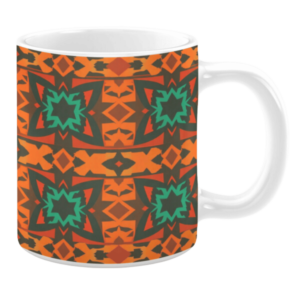 Ceramic mug featuring a geometric pattern with bold starburst designs in orange, green, and red tones on a dark brown background.