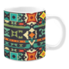 Ceramic mug featuring a vibrant tribal-inspired pattern with geometric shapes in red, orange, teal, green, and yellow on a dark background.