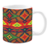 This mug features a dynamic tribal pattern with vibrant red, green, yellow, and orange hues, combined with sharp geometric diamond shapes and contrasting lines for a bold design.