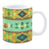 This mug features a geometric pattern with earthy tones like green, yellow, and brown. The design includes diamond and star shapes, giving it a tribal and rustic look.