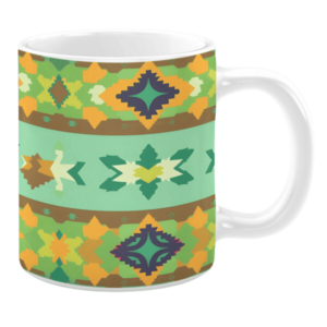 This mug features a geometric pattern with earthy tones like green, yellow, and brown. The design includes diamond and star shapes, giving it a tribal and rustic look.