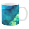 Ceramic mug displaying an abstract aquatic-inspired design in shades of teal, blue, and green. The pattern features flowing gradients and soft, glowing bubbles that create a sense of underwater movement.