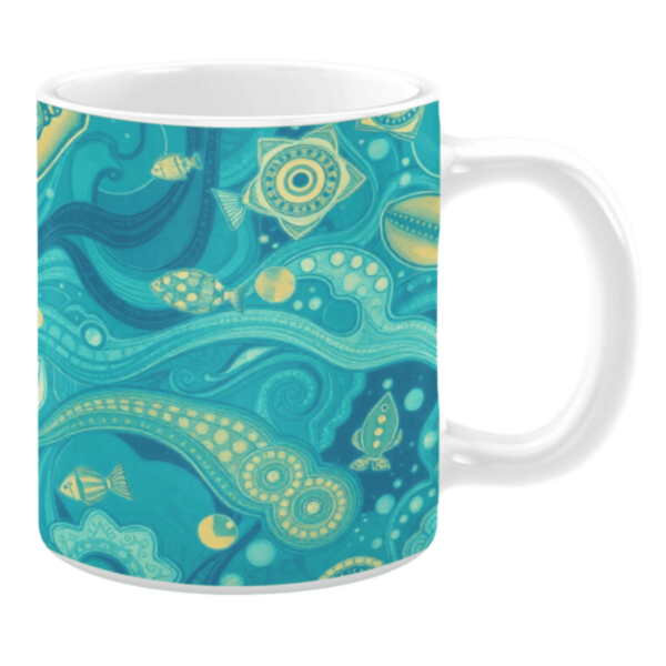 Ceramic mug featuring an intricate underwater-inspired design with swirling blue waves and detailed illustrations of marine life, including fish and sea patterns. The design incorporates shades of teal, yellow, and green, creating a fluid depiction of oceanic elements.