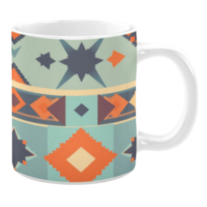 Ceramic mug featuring geometric patterns in light blue, orange, and navy blue, with starburst shapes, diamonds, and horizontal stripe accents.