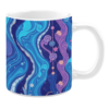 Ceramic mug showcasing a celestial-themed design with flowing blue and purple waves against a deep navy background. The artwork includes detailed planetary and star motifs connected by dotted patterns, resembling a cosmic string. Elements of gold and pastel pink add contrast, while the swirling textures create a dreamy and ethereal ambiance.
