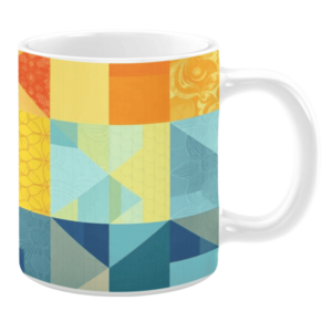 Colorful ceramic mug with geometric patterns in blue, yellow, and orange tones