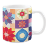 Colorful ceramic mug with floral and geometric patterns in vibrant colors