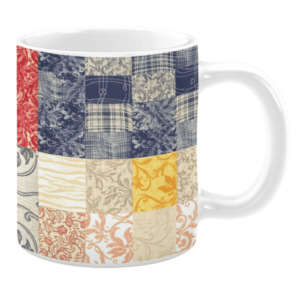 Colorful ceramic mug with patchwork patterns in blue, red, yellow, and beige tones