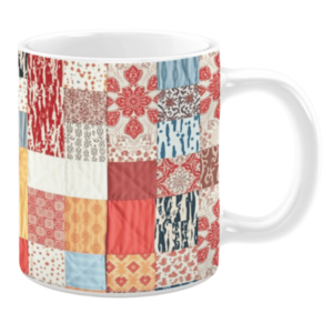 Colorful ceramic mug with patchwork patterns in red, beige, and blue tones
