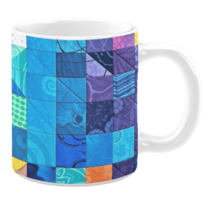 Colorful ceramic mug with patchwork patterns in blue, purple, and orange tones
