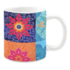 Colorful ceramic mug with geometric floral patterns in blue, orange, and pink tones