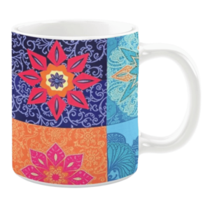 Colorful ceramic mug with geometric floral patterns in blue, orange, and pink tones