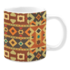 Ceramic mug with an intricate geometric design in warm shades of orange, brown, and yellow, featuring diamond shapes, stars, and teardrop motifs in horizontal bands.