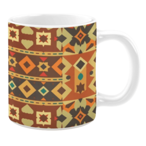 Ceramic mug with an intricate geometric design in warm shades of orange, brown, and yellow, featuring diamond shapes, stars, and teardrop motifs in horizontal bands.